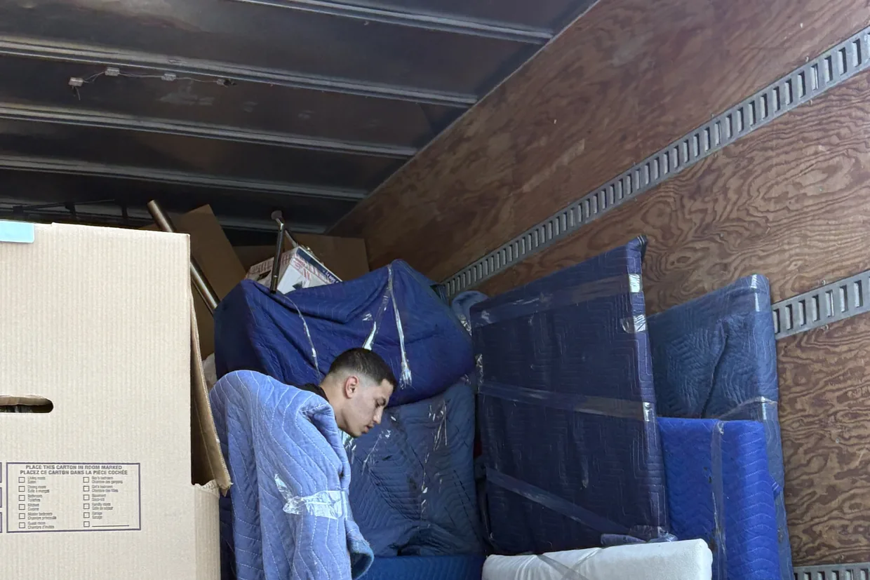 Furniture wrapped and stacked inside a Motion Transport truck loaded for a long distance move